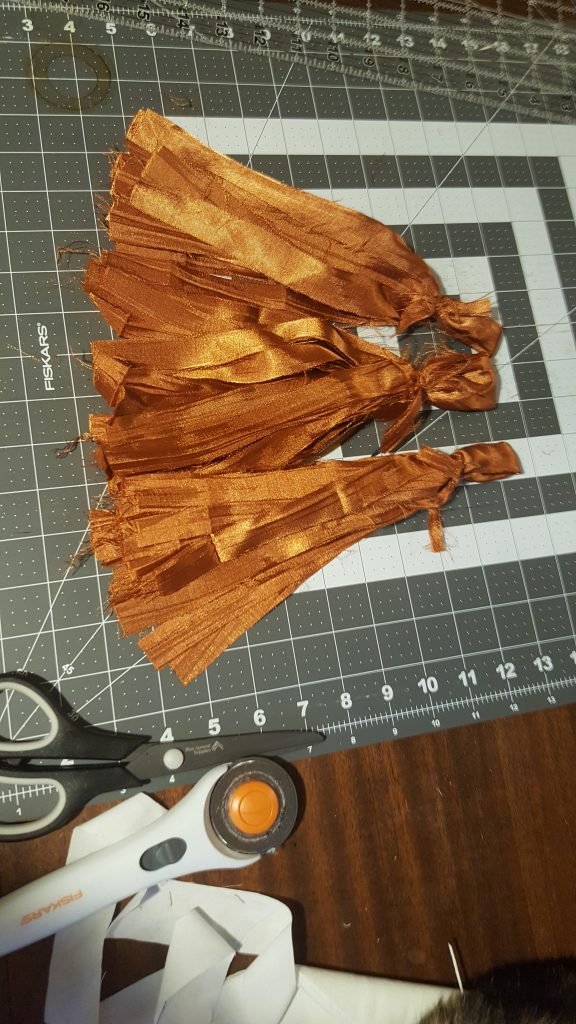 orange tassels rolled and folded
