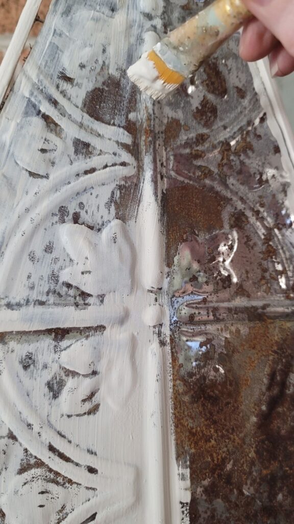 dry brush white paint on tin tile tree