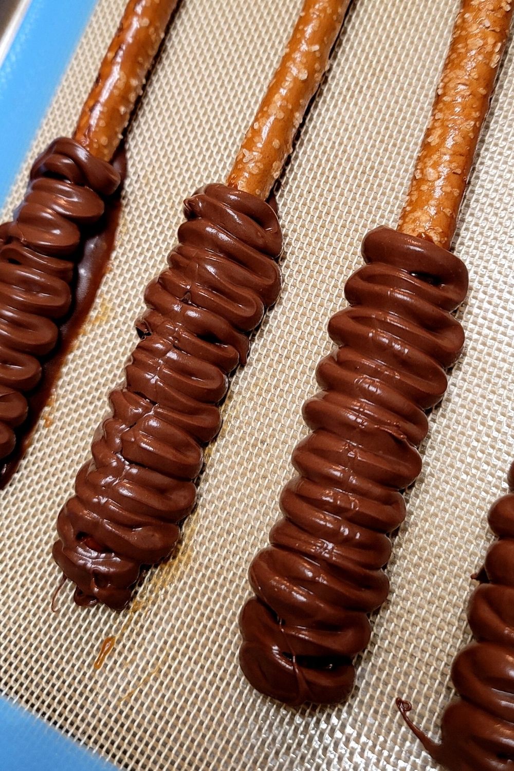 3 pipe chocolate in zig zag pattern on set caramel for caramel chocolate pretzel logs