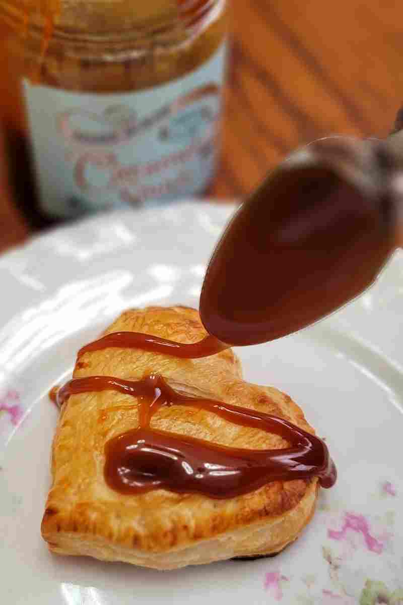 drizzle caramel over heart shaped apple strudel